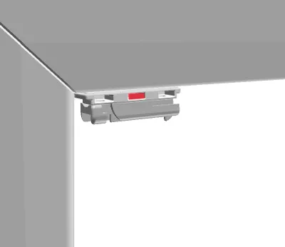 A close-up view of a window blind accessory attached to a window frame.