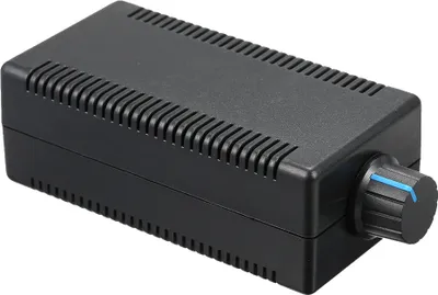 A black electronic device with a knob on the side, shown from a slight angle against a white background.