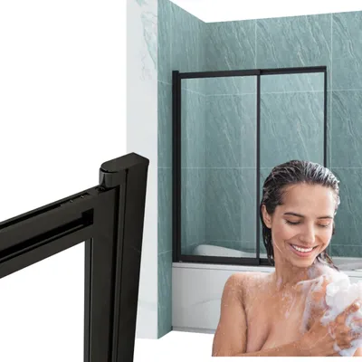 A woman is showering in a bathtub with a shower screen.