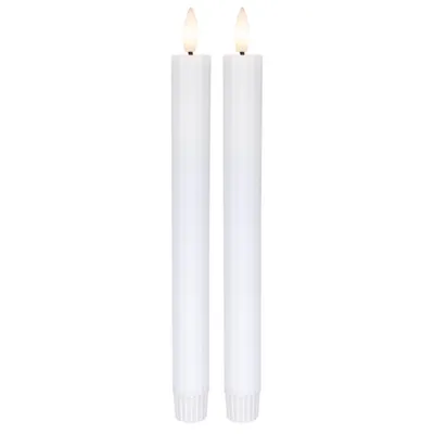 Two white LED candles with flickering flames are shown against a white background.