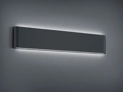 A dark gray, rectangular wall light fixture with subtle white LED lighting along the top and bottom edges, mounted on a gray wall.