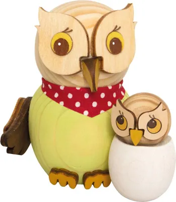 Two wooden owls, one larger and one smaller, are displayed against a white background. The larger owl is wearing a red and white polka dot bandana. The smaller owl is nestled in a white egg-like base.