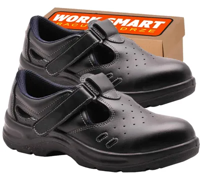 A pair of black work sandals with a box in the background.
