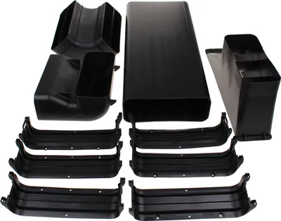 A collection of black plastic ventilation components, including ducts and connectors, laid out on a white background.