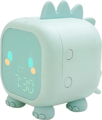 A cute, mint green dinosaur-shaped digital alarm clock with a digital display showing the time.