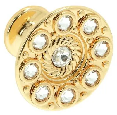 Imagen del producto de Pomo para muebles, fabricado en zamak y cristal, con un diámetro de 32 mm y acabado en dorado