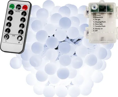 A string of white LED ball lights with a remote control and a battery pack.