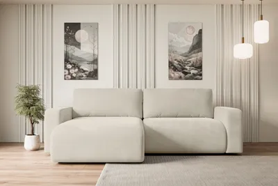 A modern living room with a beige sectional sofa, decorative wall panels, and artwork.