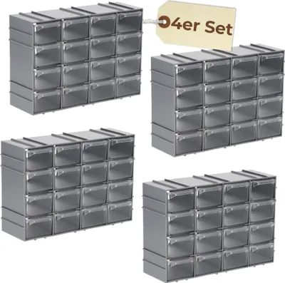 Four identical stacks of small storage drawers are arranged in a grid formation against a white background. A small, light brown tag with text is attached to the top right stack.