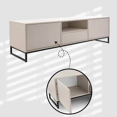 A beige TV cabinet with a black frame and a drawer, shown with a close-up detail of an open compartment.