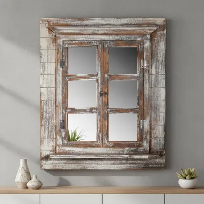 A decorative mirror designed to look like a window with shutters, placed on a shelf.