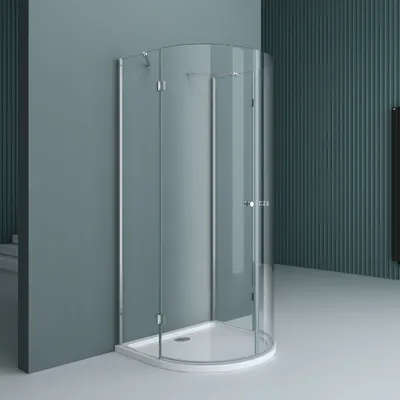 A modern shower cabin with glass doors and a white base, set against a teal wall.