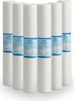 A group of six white cylindrical water filters arranged in a row.