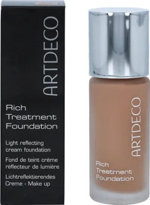 A bottle of Artdeco Rich Treatment Foundation and its packaging are shown against a white background.