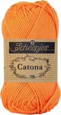 A ball of orange yarn with a label.