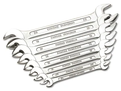 A set of chrome vanadium wrenches is displayed diagonally against a white background.