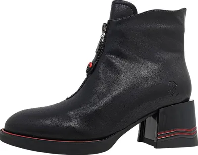 A black leather ankle boot with a zipper and red accents.