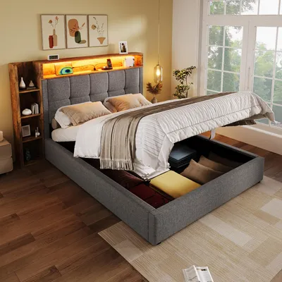 A bedroom scene with a bed featuring storage and LED lighting.