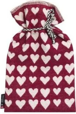 A red drawstring bag with a white heart pattern, tied with a black and white cord.