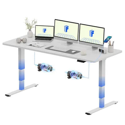 A white standing desk with multiple monitors, a laptop, and accessories.