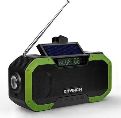 A portable solar-powered radio with a green and black design, shown against a white background.