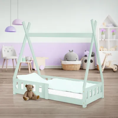 A child's teepee-style bed in a nursery or playroom setting.