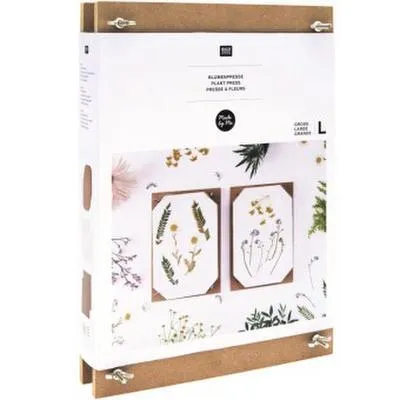 A product package for a flower press, showing examples of pressed flowers.