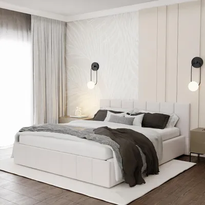 A bedroom scene with a bed, curtains, and wall decor.