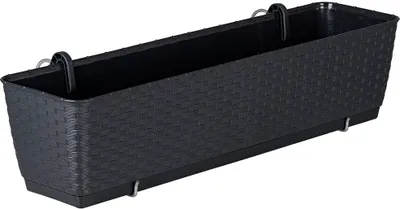 A black rectangular balcony planter box with a woven texture, shown from a diagonal angle against a white background.