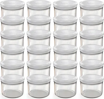 A grid of clear glass jars with white lids.