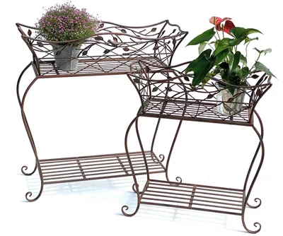 Two metal plant stands with baskets, each holding a potted plant, are displayed against a white background.