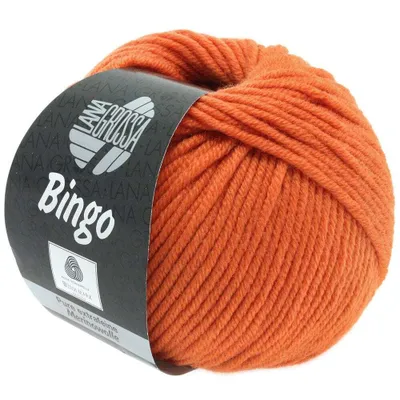 A ball of orange yarn with a label.