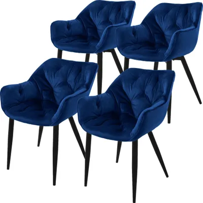 A set of four dark blue velvet dining chairs with black legs, displayed against a white background.
