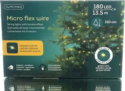 The image shows the packaging of Lumineo Micro flex wire string lights, with a Christmas tree decorated with the lights in the background.