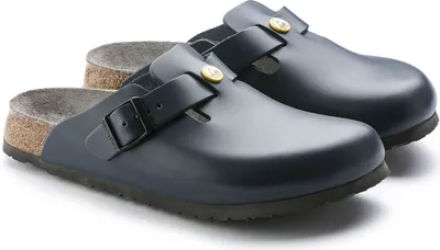 A pair of blue Birkenstock Boston ESD clogs are shown against a white background.