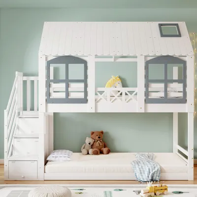 A white bunk bed shaped like a house with gray window frames and a yellow unicorn pillow on the top bunk.