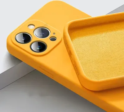 A close-up view of the back of a yellow iPhone case, showing the camera cutout and the interior lining.