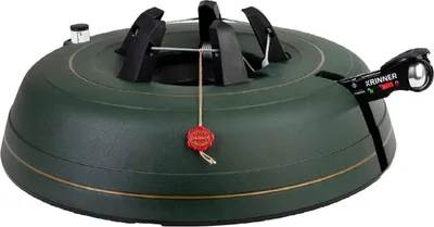 A green Christmas tree stand with a gold trim and a red seal.
