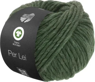 A ball of green yarn with a dark label wrapped around it.