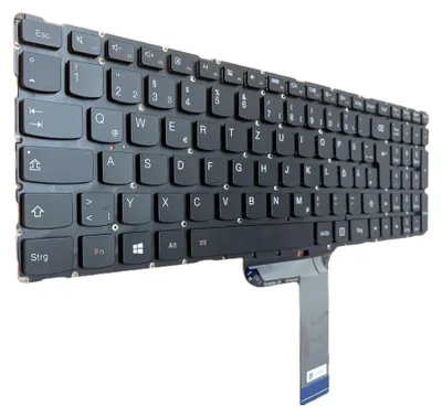 A close-up, angled view of a black laptop keyboard with a white background.