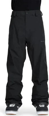 A person wearing black pants and black shoes.