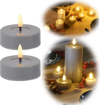A collage of LED candles on a table, some with decorative elements like leaves and berries.