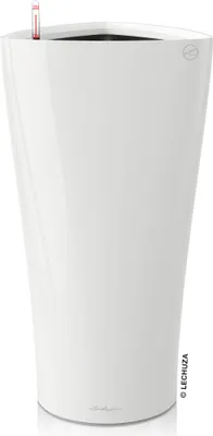 A tall, white, glossy plant pot with a water level indicator visible at the top.