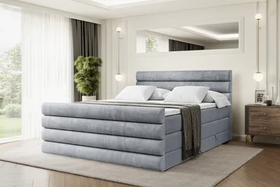 A bedroom setting with a bed as the main focus.