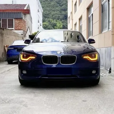 Immagine prodotto di Fari a LED con luci diurne e effetto "angel eyes", compatibili con BMW Serie 1 F20/F21 (2011-2015), colore nero, con indicatori di direzione dinamici