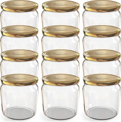 A studio shot of twelve empty glass jars with gold screw-on lids, arranged in four rows of three.