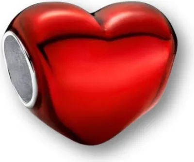 A close-up studio shot of a red heart-shaped charm with a silver opening.