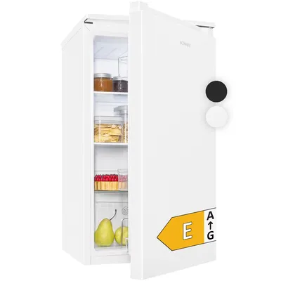 A white Bomann refrigerator with its door open, showing food items inside and an energy efficiency label on the door.