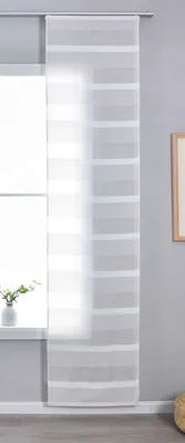 A sheer curtain with horizontal stripes hangs in front of a window.