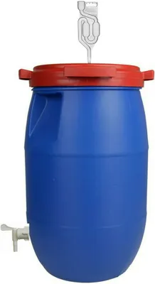 A blue fermentation barrel with a red lid and a fermentation lock on top.